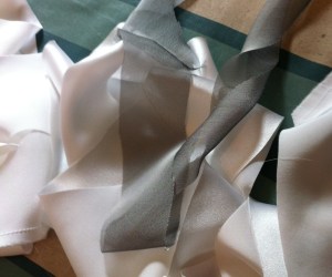 White silk bias tape and polyester chiffon bias tape. A match made in hell.