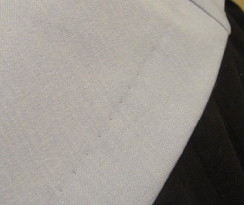 Machine-stitched hem. Boo, couture fail.