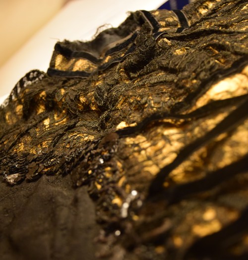 Lace stomacher, yoke, and collar.