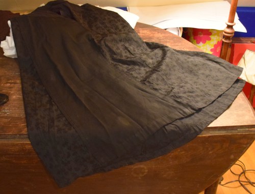 Trying to get a full-view of the skirt and failing. It's not particularly full. With all the piecing, I wonder if they were running out of fabric?