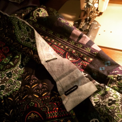 Wash-away stabilizer behind buttoholes